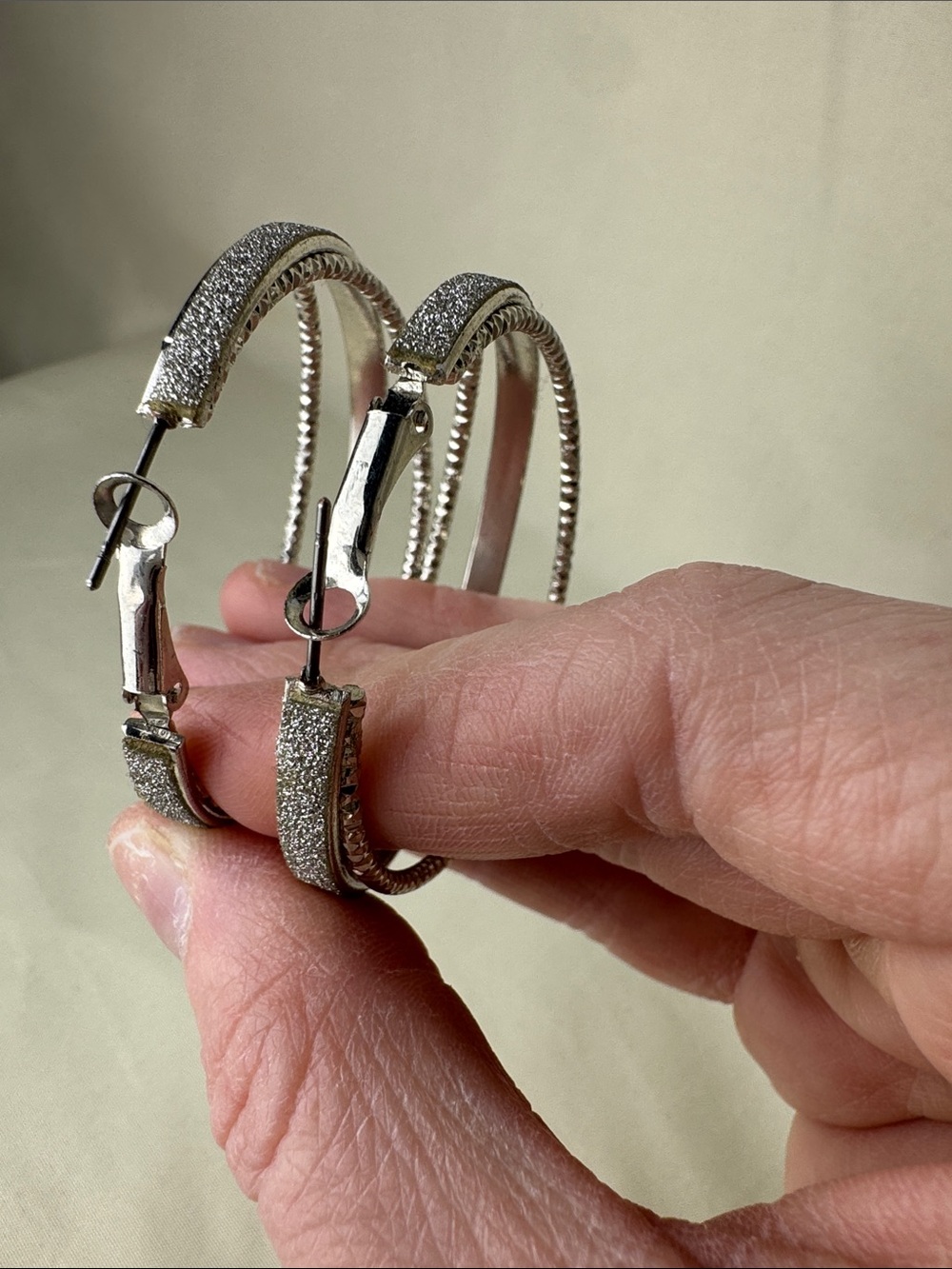 Bundle of Sparkly Multi-Tone Hoop Earrings in Gold, Silver, and Black - Picture 7 of 8